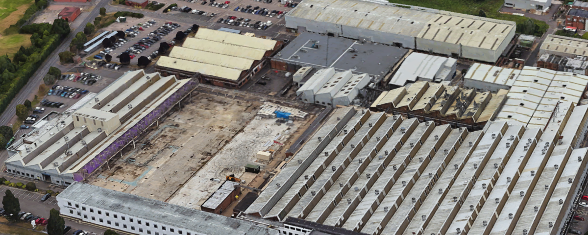 Fire safety advisory building with multiple industrial units and parking area.