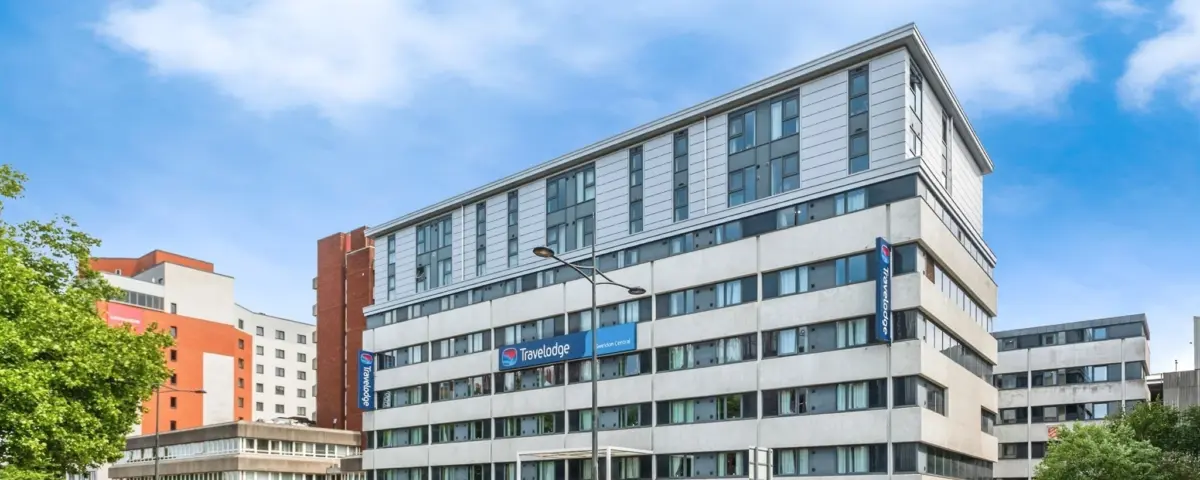 Modern office building with JRA Fire Safety Advisors signage in an urban setting.
